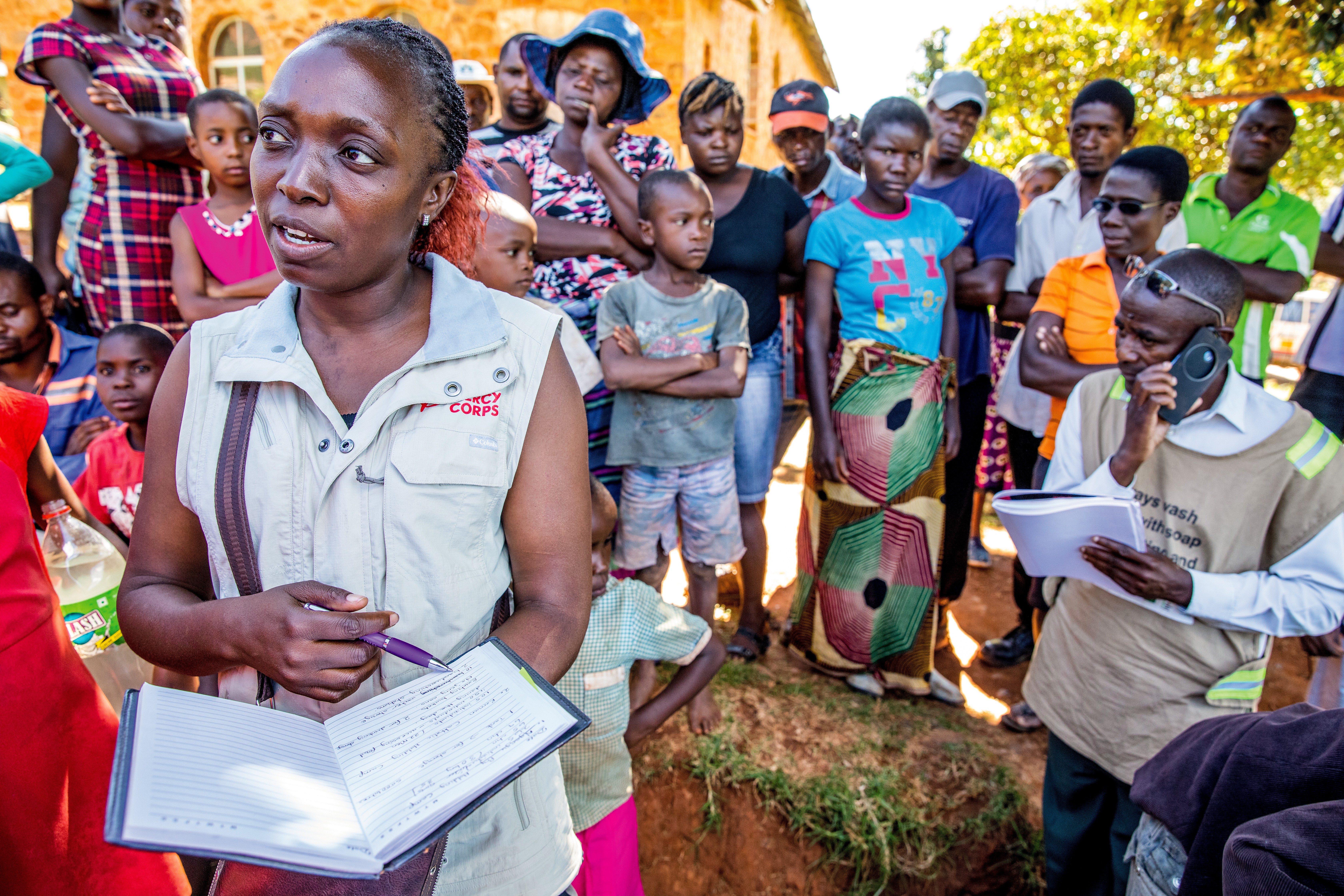 Mercy Corps employee with community.