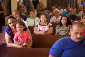 Families gather at a Mercy Corps distribution to receive a water filtration system and cash in the city of Las Marias. Located high in the rural Puerto Rican mountains, Las Marias suffered devastating damage to its infrastructure that could take years to rebuild.