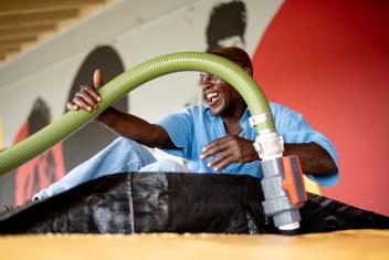 Working with Mission Resolve Foundation, Mercy Corps team members install a reverse osmosis water treatment plant, making saline water safe for cooking, bathing and drinking. Photo: Mission Resolve Foundation